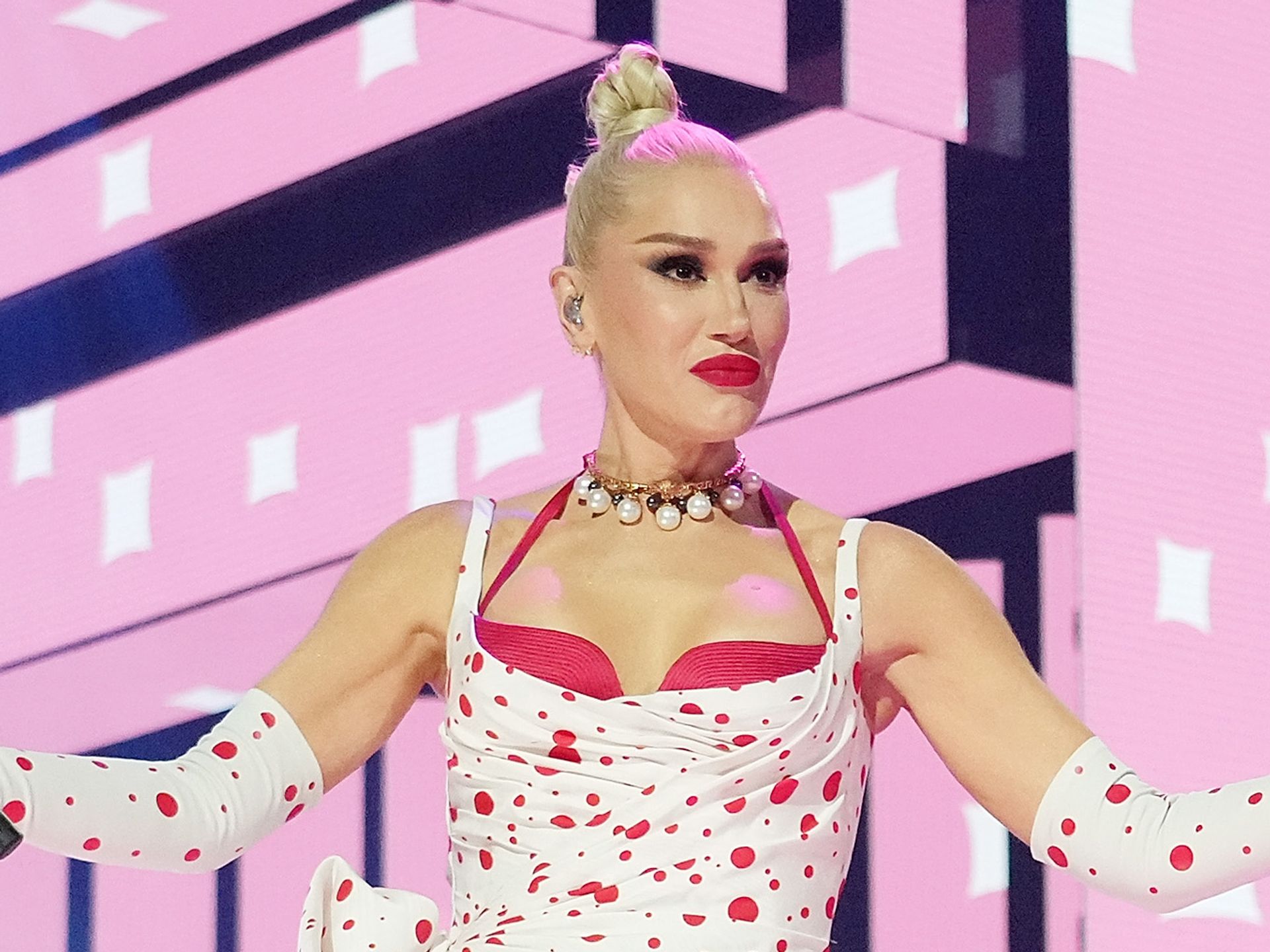 Gwen Stefani cuts a fashionable figure in pink dress and tights in