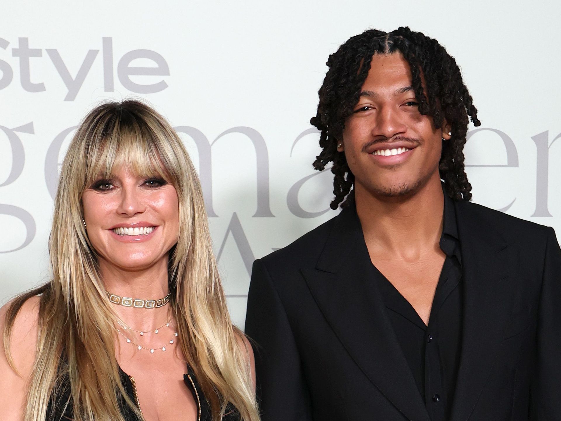 Heidi Klum wows in zip-up dress as she holds hands with model son