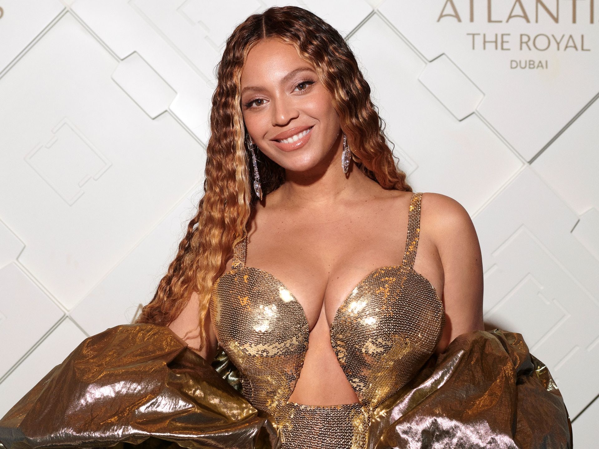 Beyoncé dazzles in show-stopping dress with impossibly high slit and  fishnet tights for latest Renaissance concert