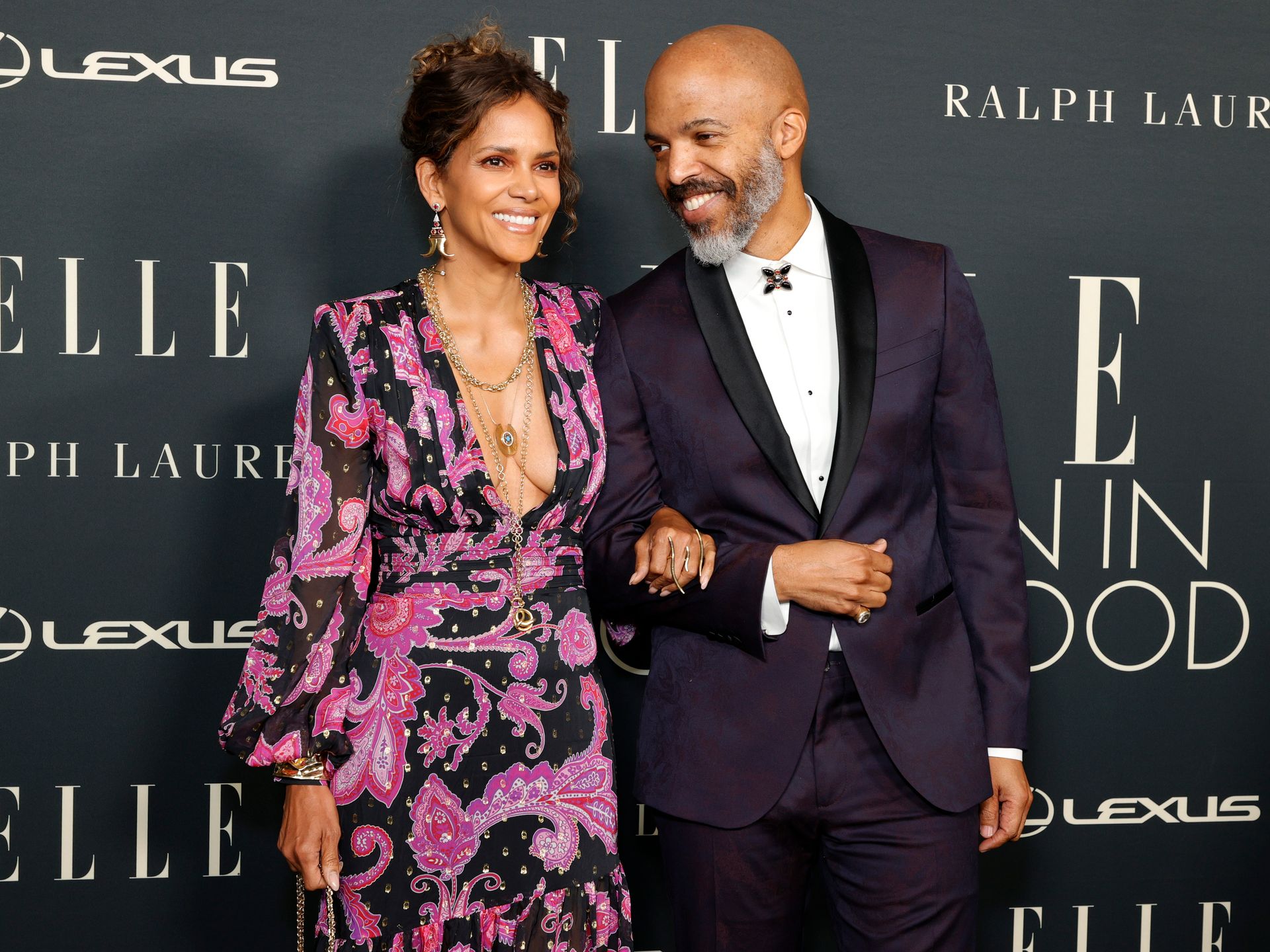 Halle Berry rocks plunging dress with high slits for rare