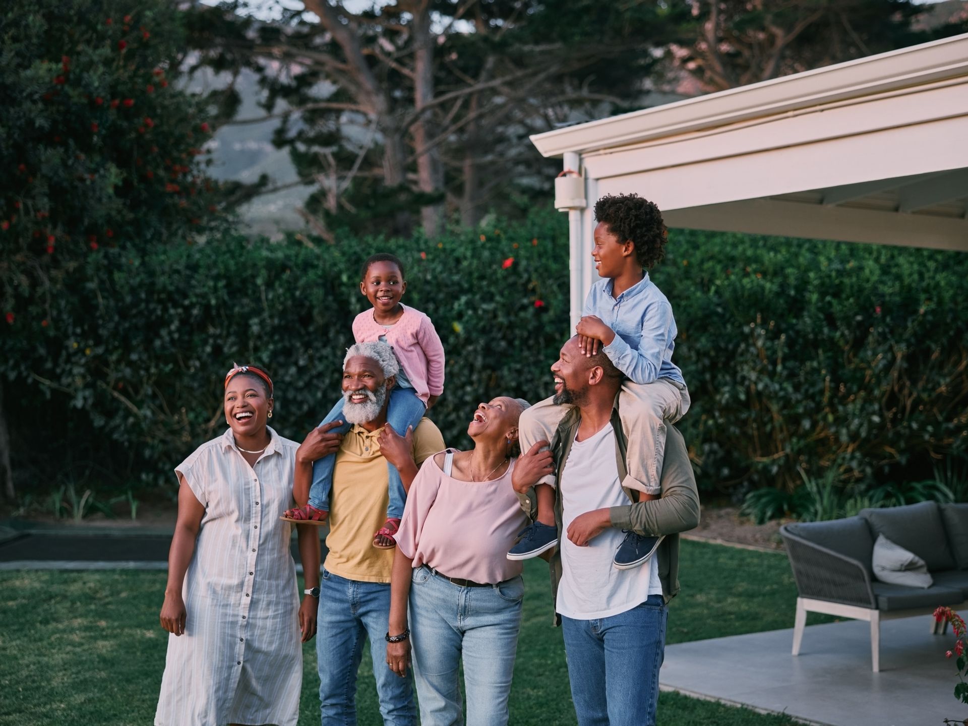 Multi-generational family enjoying time together in yard