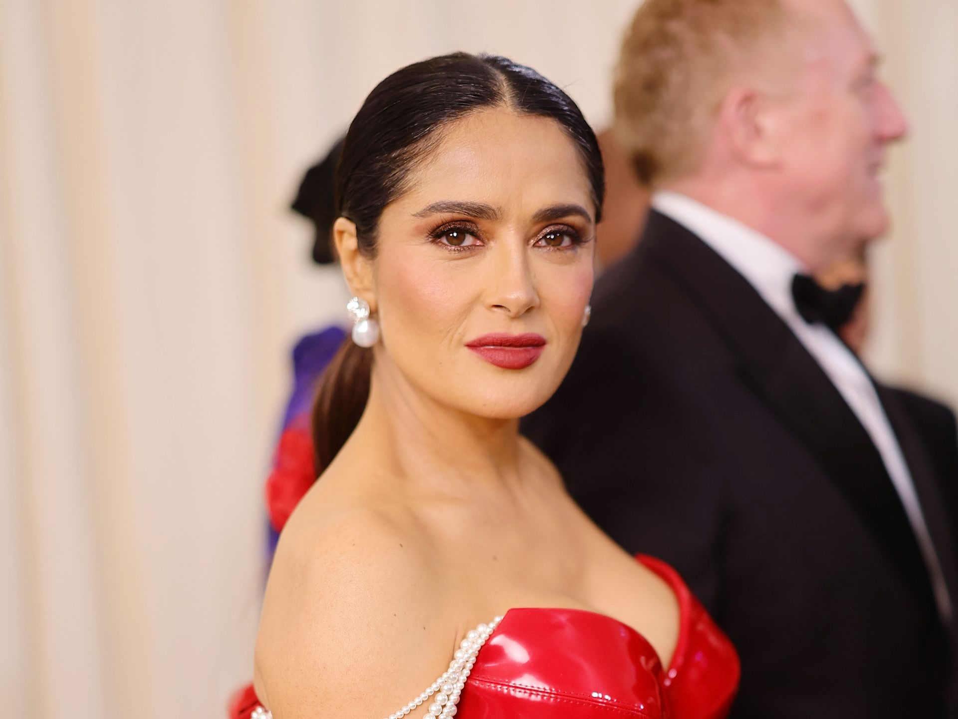 See Salma Hayek Busting Out Of A Tiny Black Lace Bra