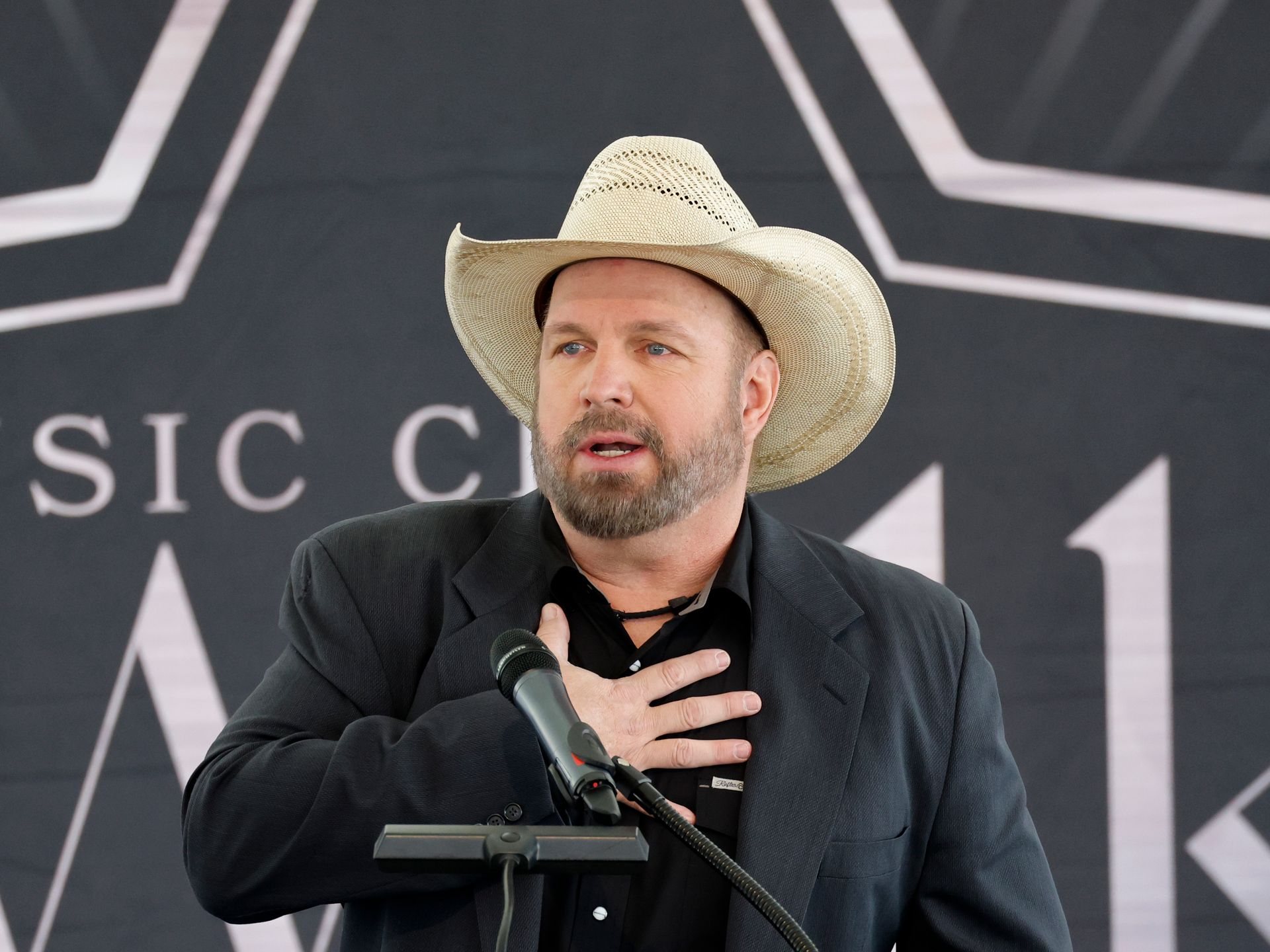 Garth Brooks pens emotional message as he returns to the stage hours after denying sexual assault allegations | HELLO!