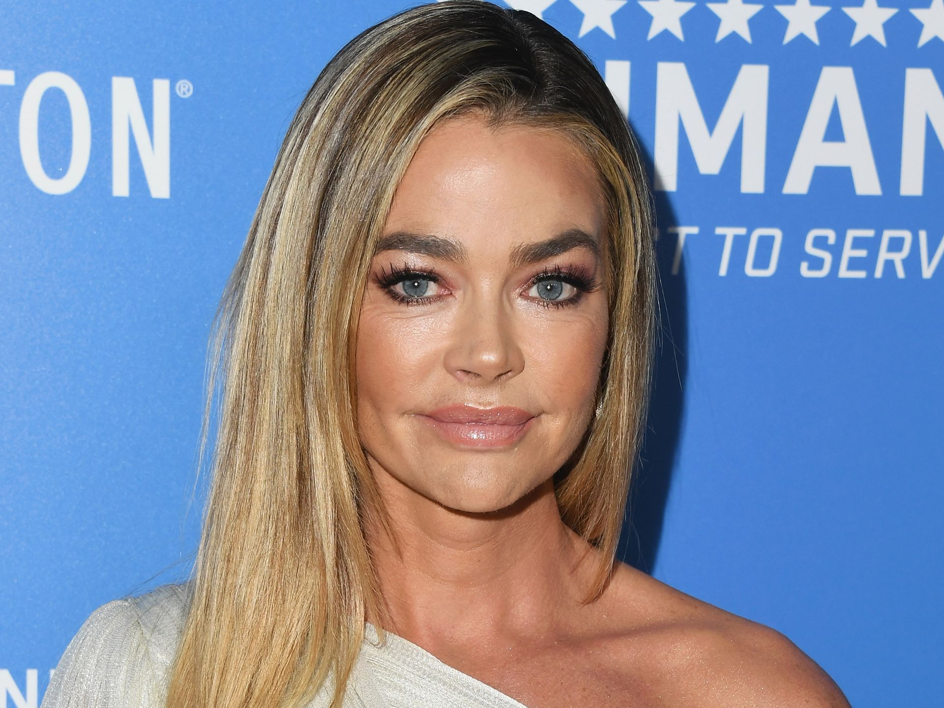 Denise Richards, 52, looks incredible as she poses in fitted lace mini  dress - wow | HELLO!