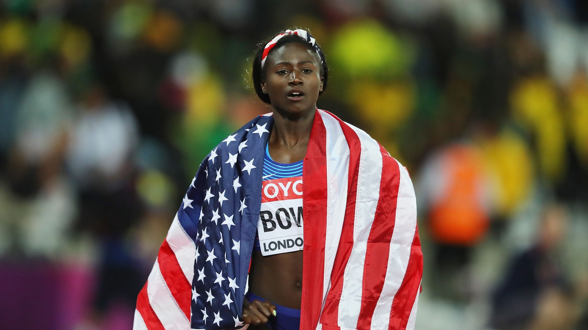 tori bowie on track with american flag