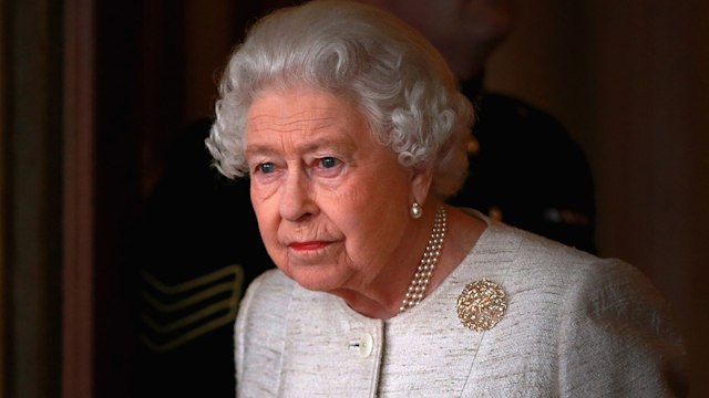 the queen looking sad serious