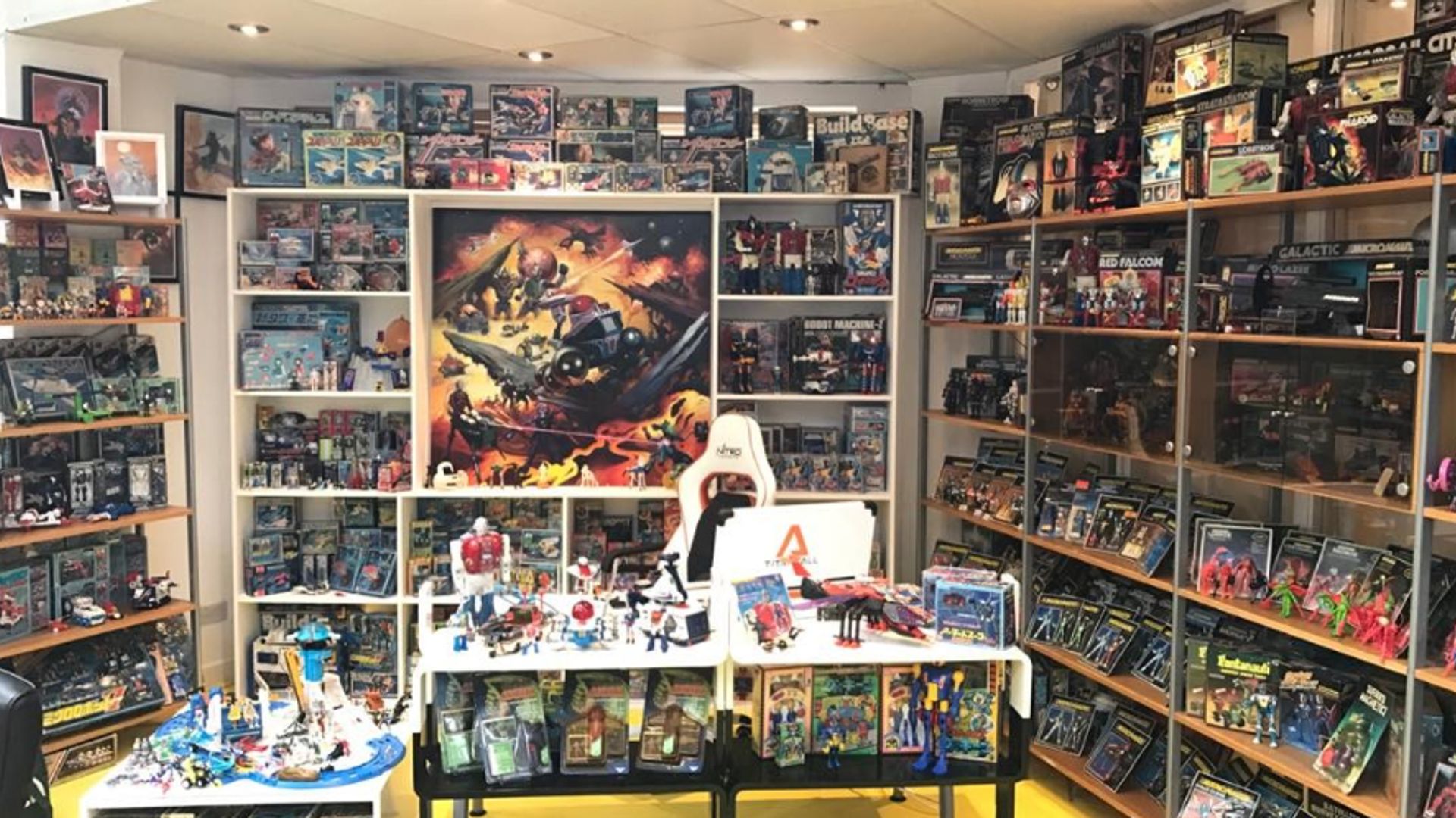 Several shelves and tables filled with movie memorabilia