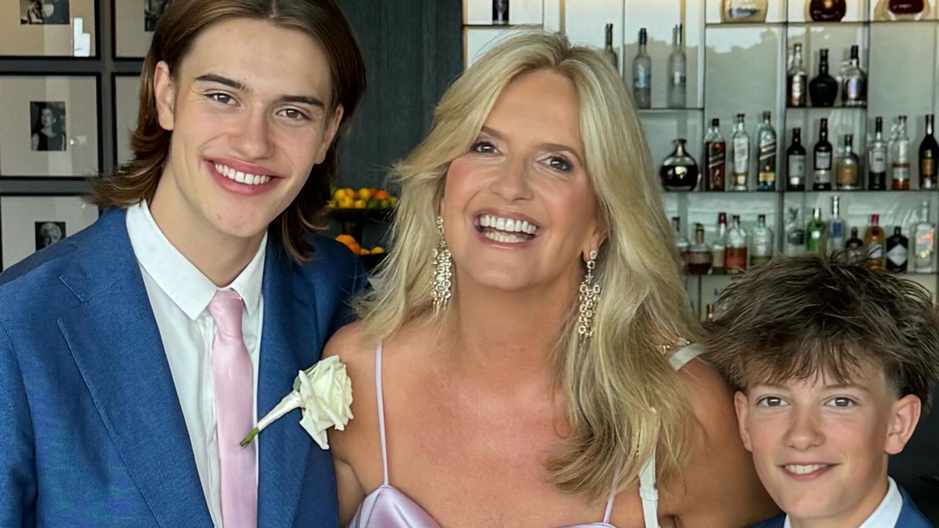 Penny Lancaster, 53, dazzles in split-leg satin gown for stepson's lavish wedding