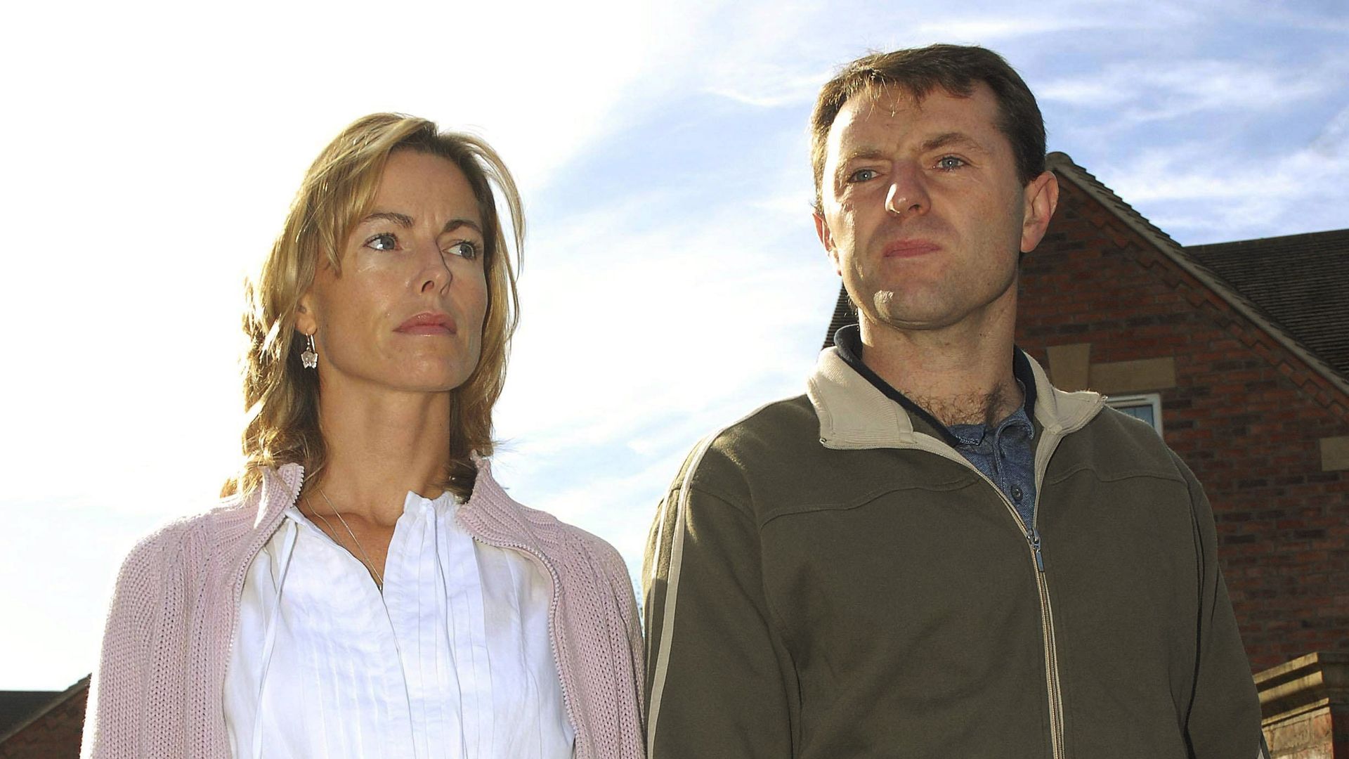 Kate and Gerry McCann walk outside their house