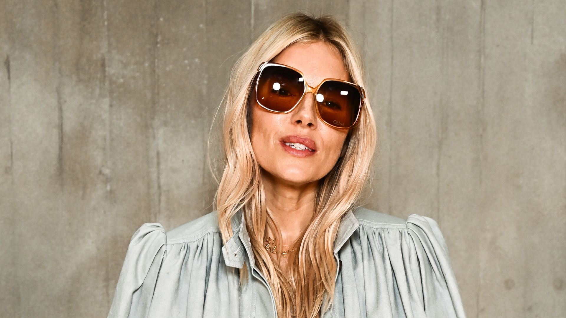 Sienna Miller epitomises seventies boho chic at the Chloé show