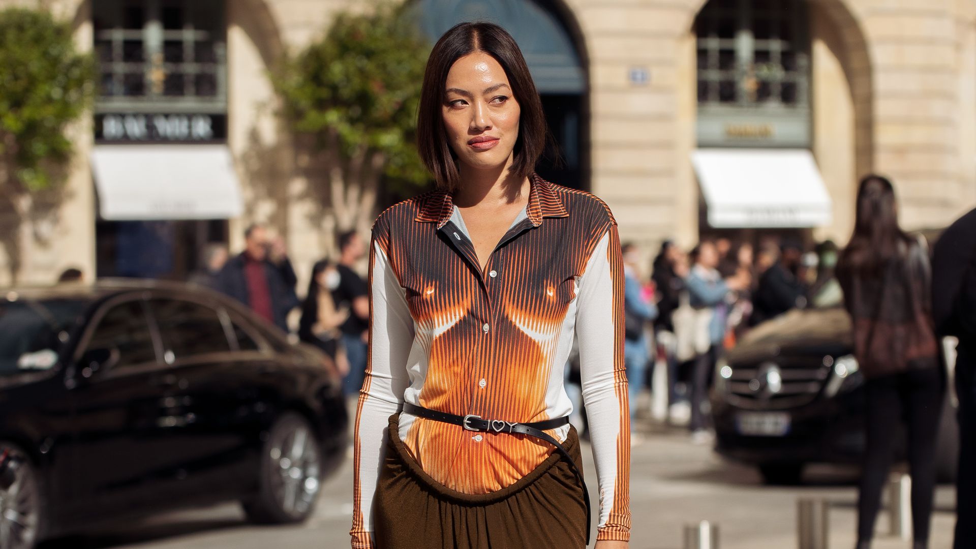 PARIS, FRANCE - SEPTEMBER 29: Tiffany Hsu wearing a brown, white, orange top and long brown maxi skirt outside the Chloe show during Paris Fashion Week S/S 2023 on September 29, 2022 in Paris, France. (Photo by Raimonda Kulikauskiene/Getty Images)