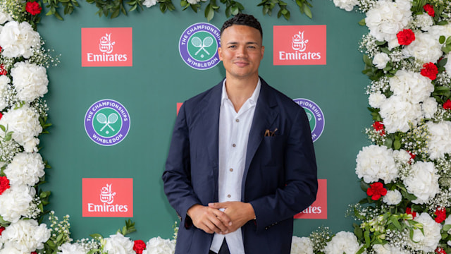 Jermaine Jenas in front of a green background