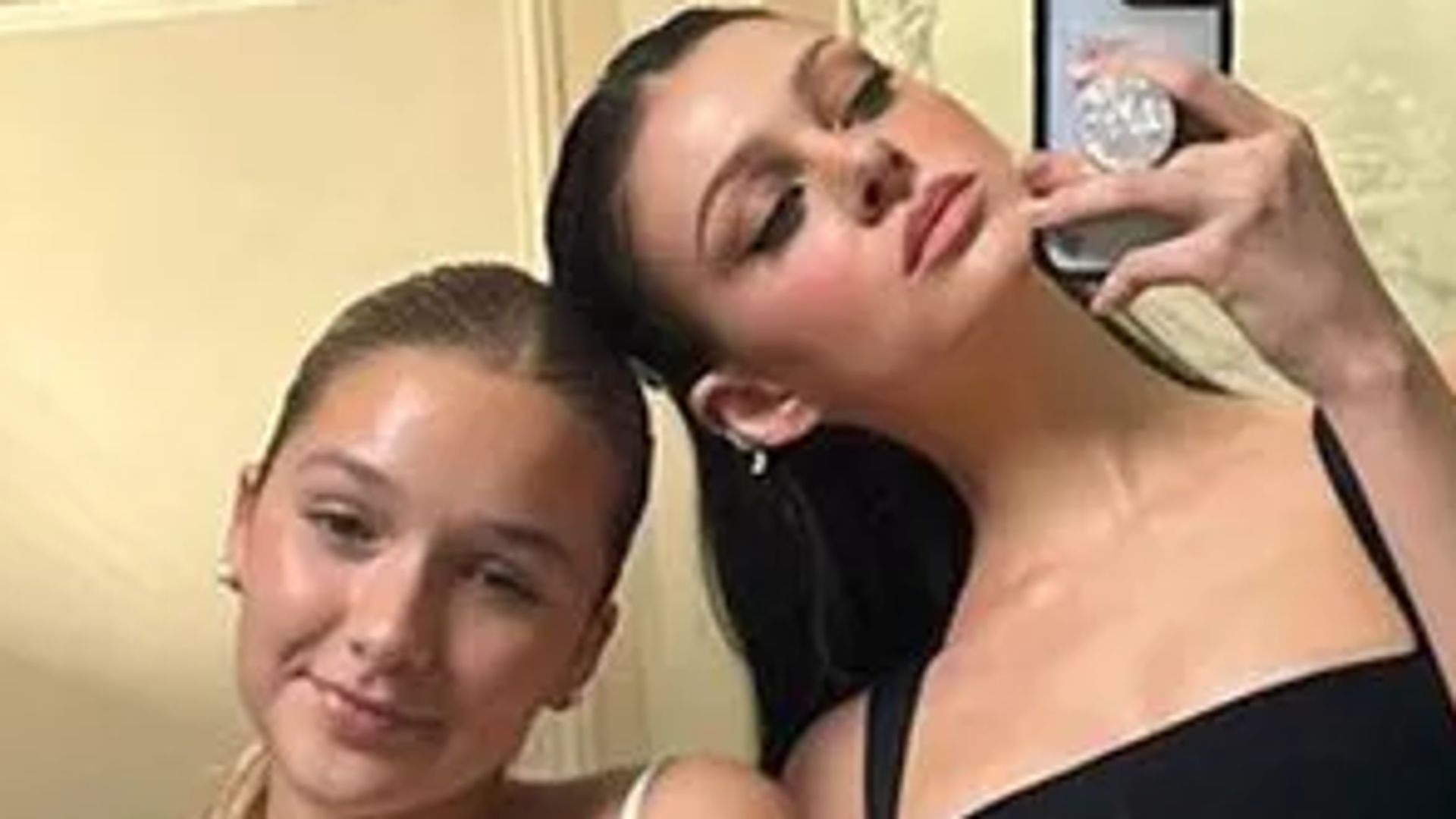 Harper Beckham and sister-in-law Nicola Peltz twin with glossy straight hair in new photo
