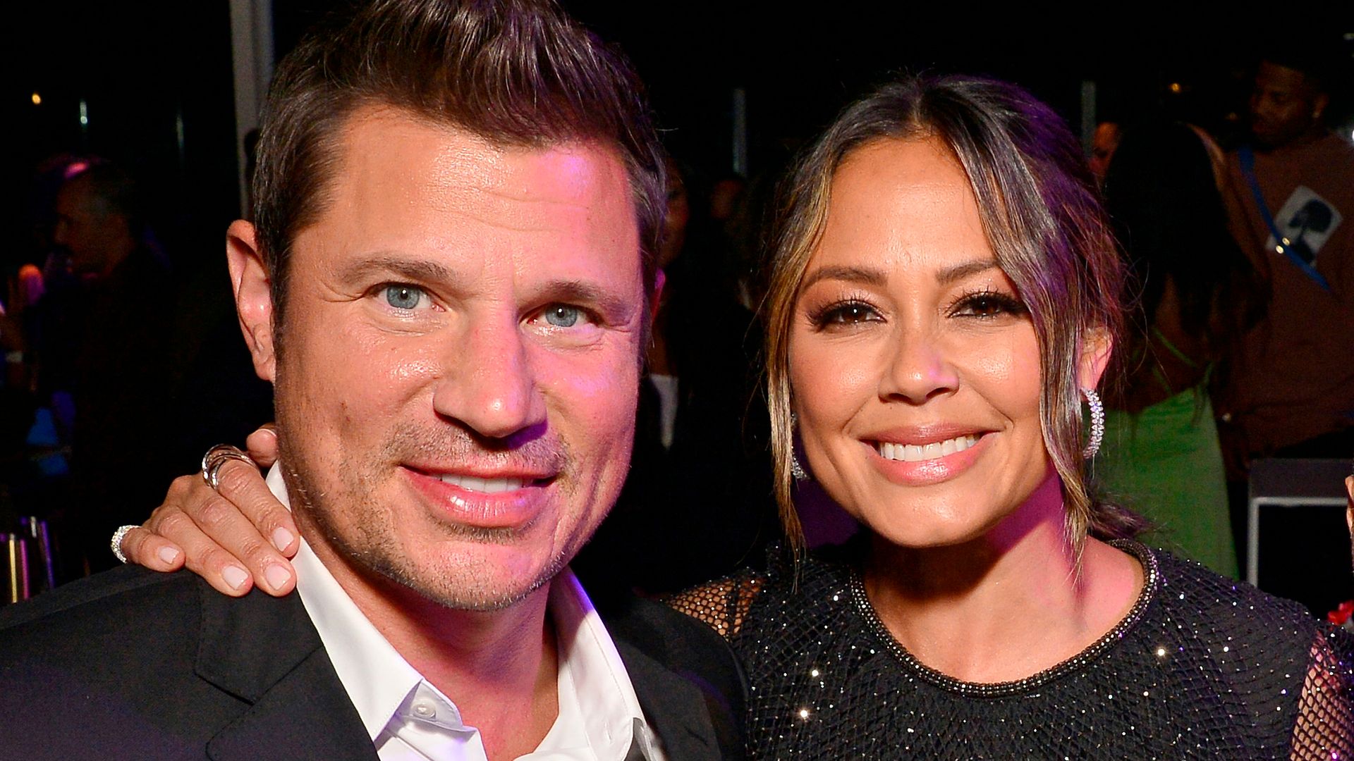 Vanessa Lachey and Nick Lachey smiling at the camera