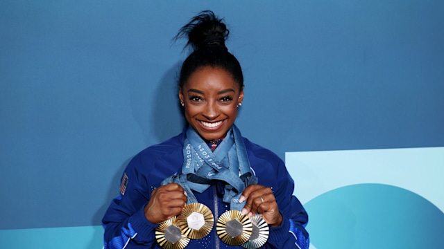 simone biles holding 2024 olympic medals