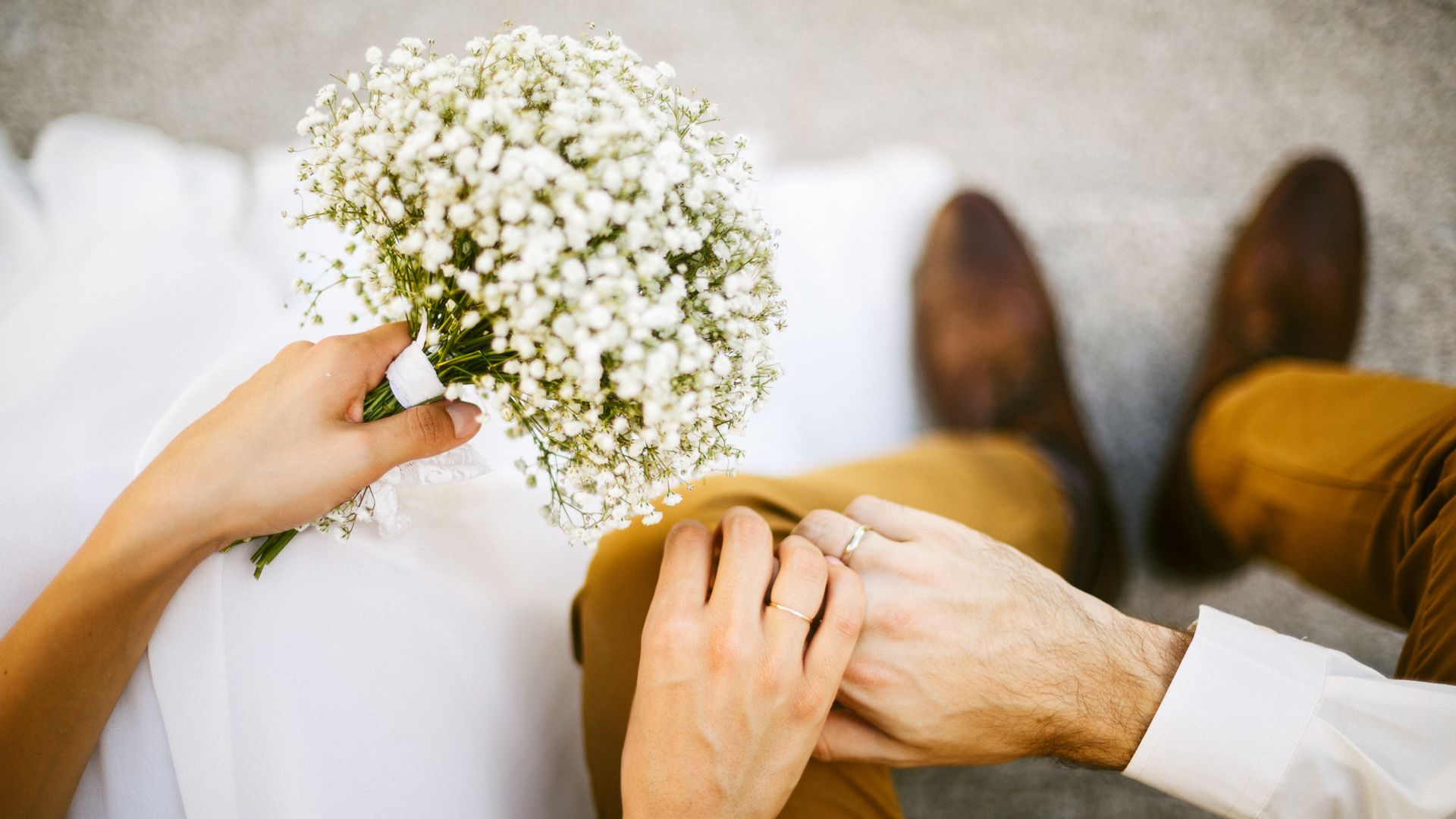 Bride and groom holding their hands together