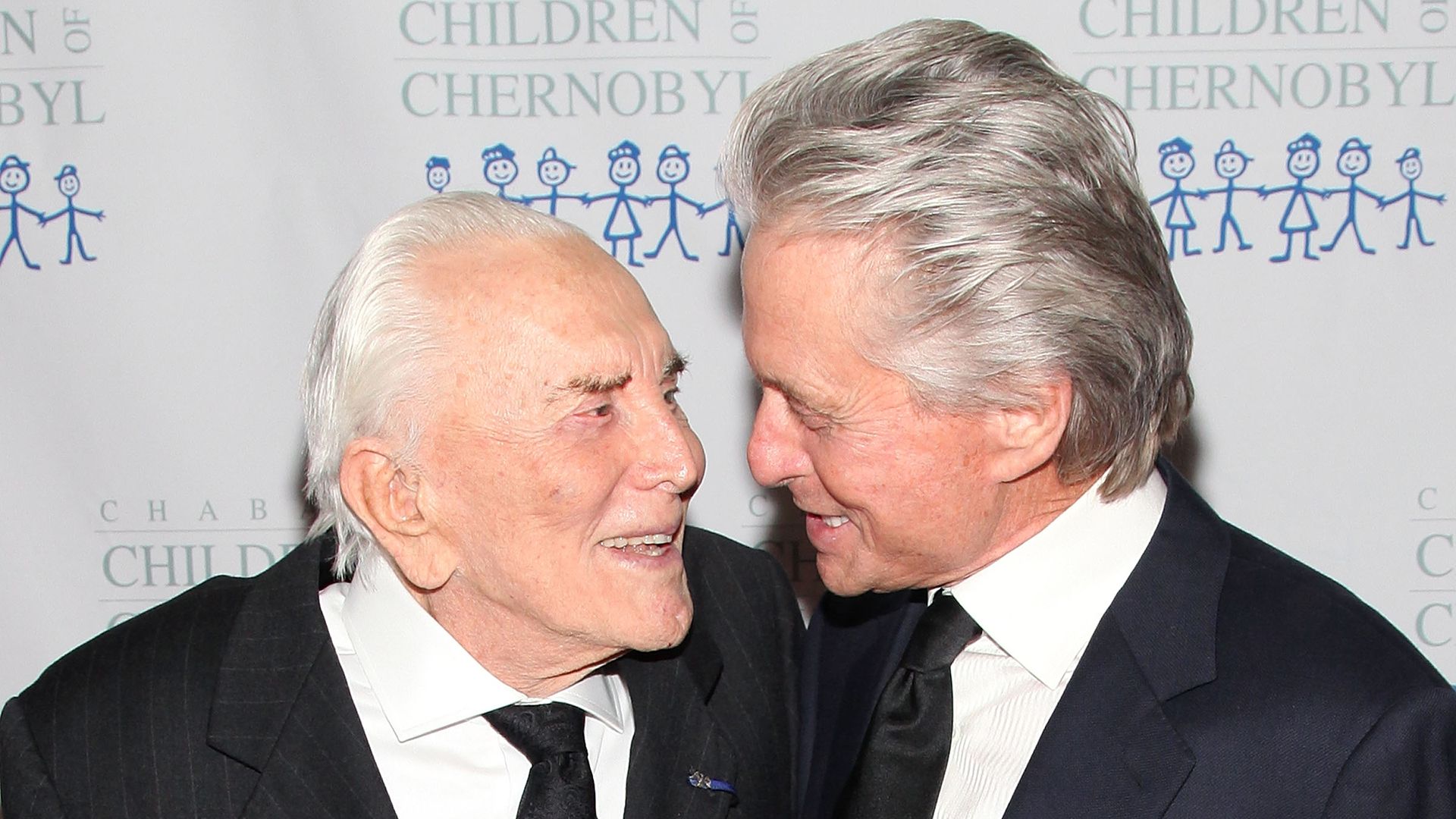 Michael and Kirk Douglas chat at  Children Of Chernobyl's Children At Heart Gala in 2011