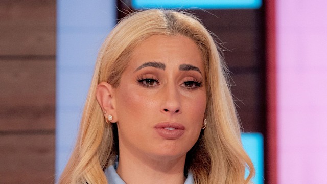 Stacey Solomon in a blue outfit looking emotional