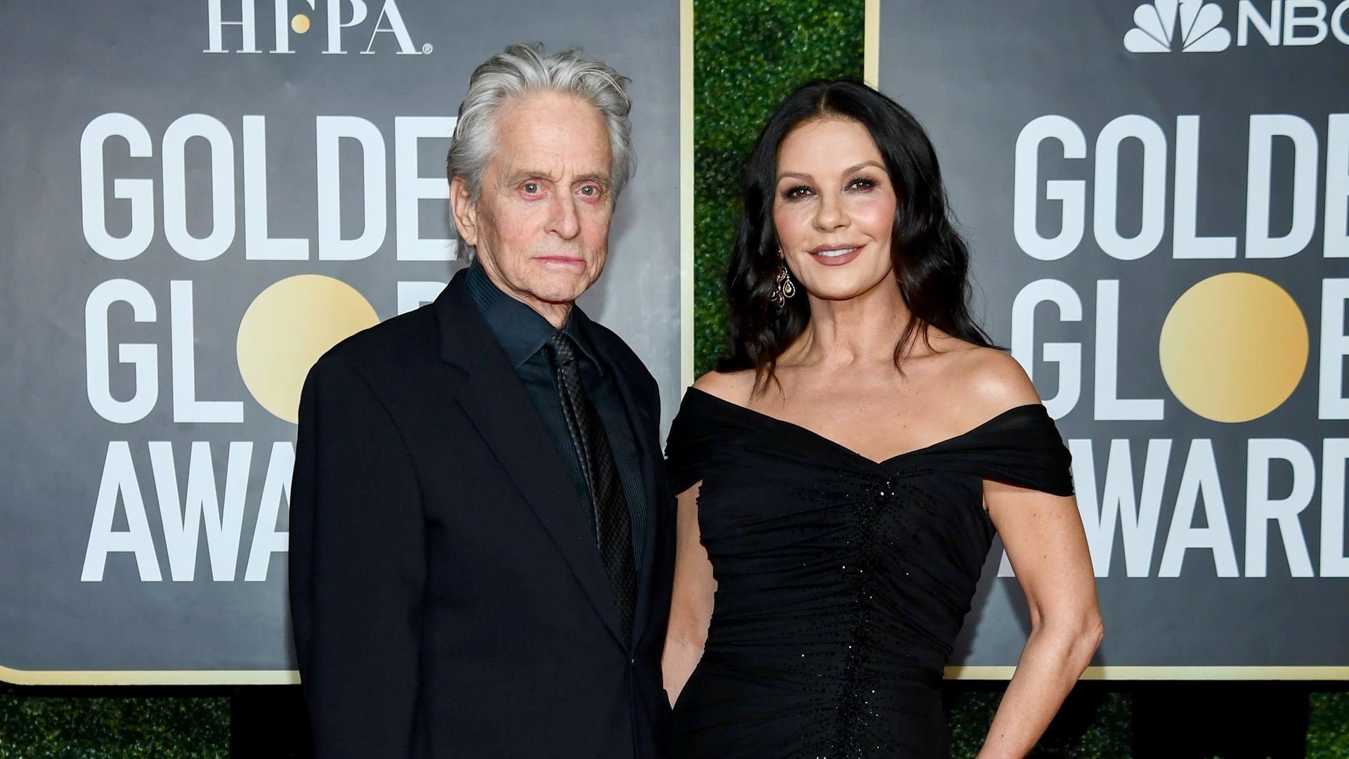 catherine zeta jones and michael douglas wearng black golden globes red carpet