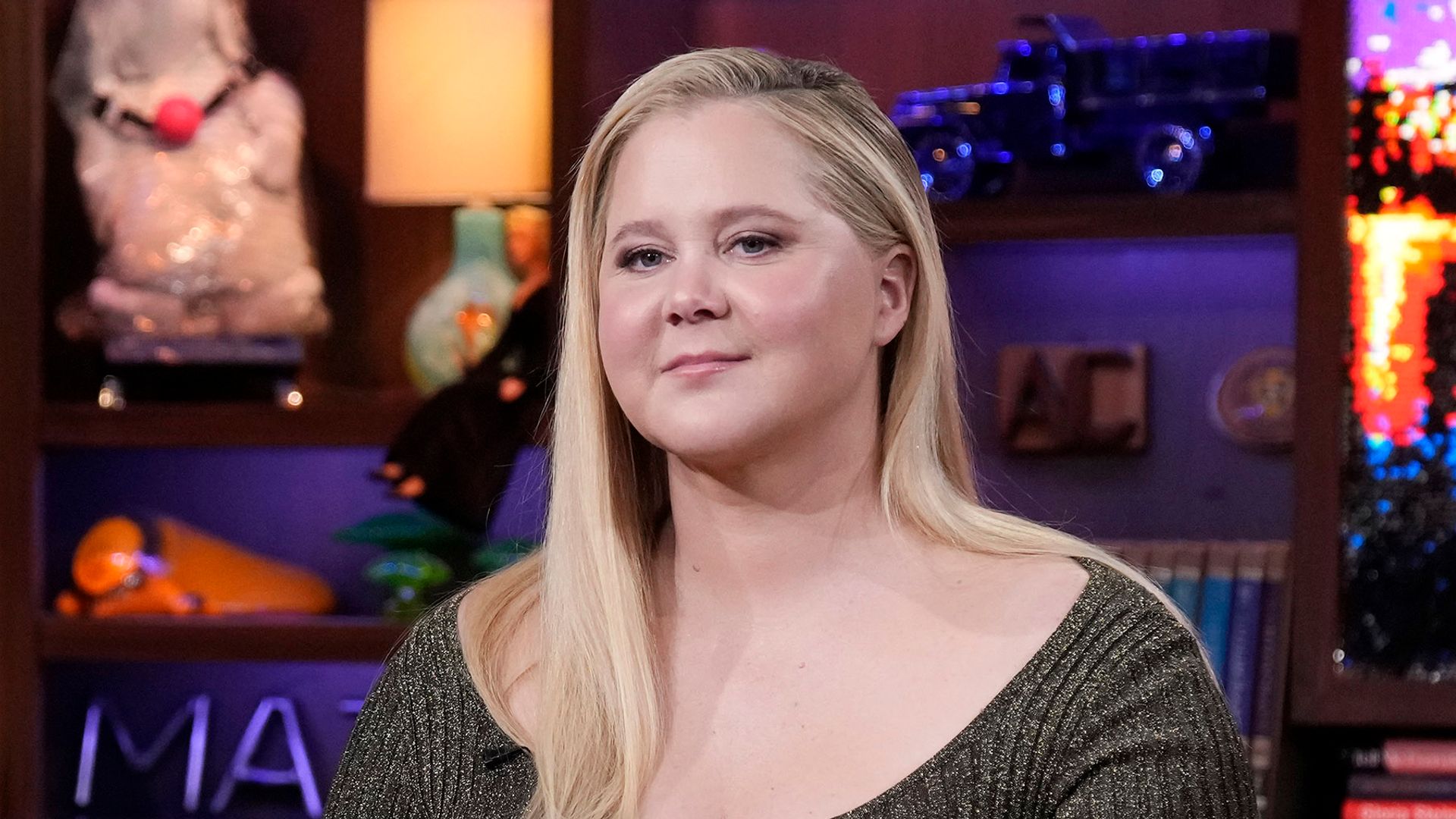 Amy Schumer showcases her incredible slimmed-down physique in fitted swimsuit