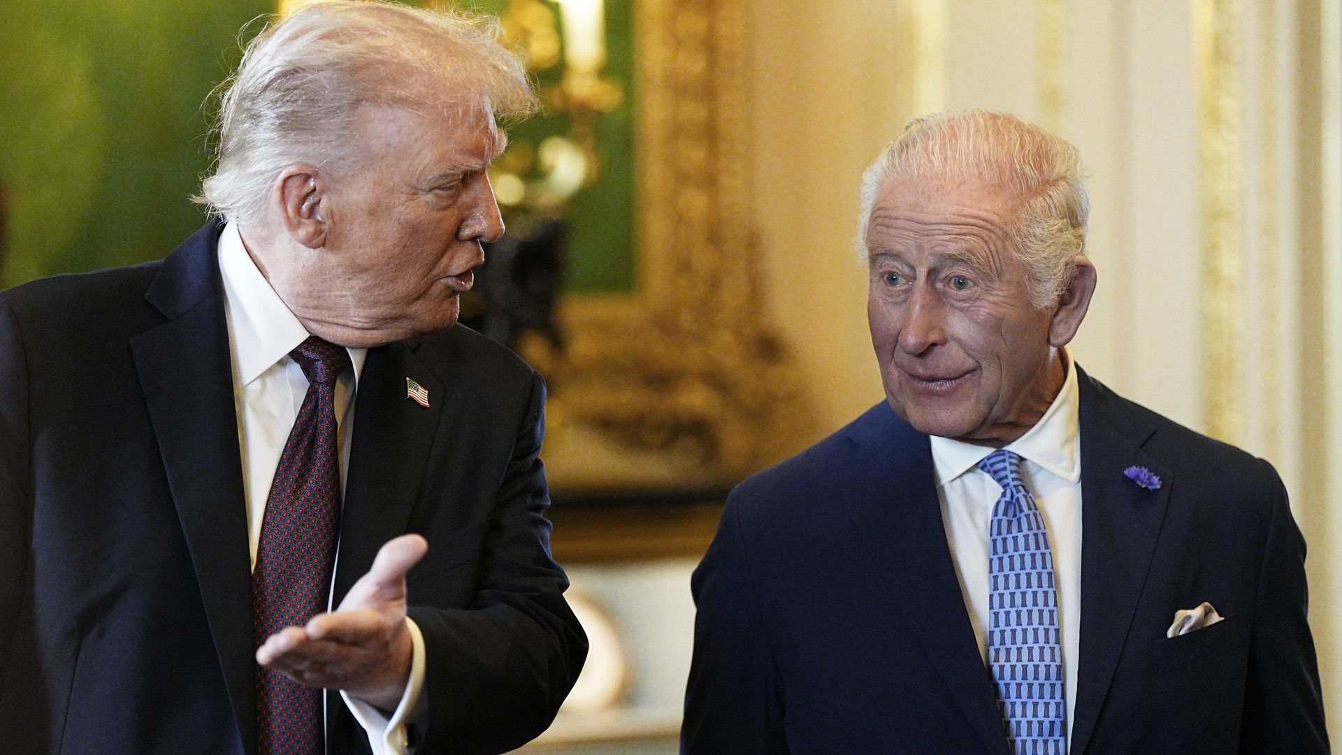 President Trump gesturing while King Charles looks surprised