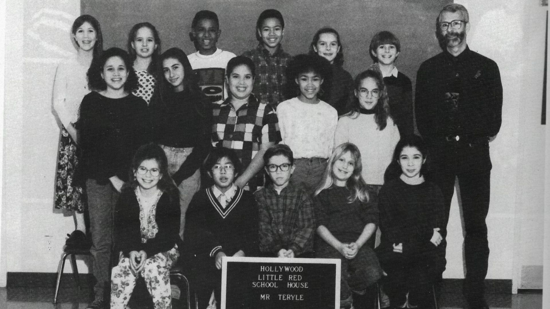 A black-and-white school photo with Meghan Markle (middle row, far-left)