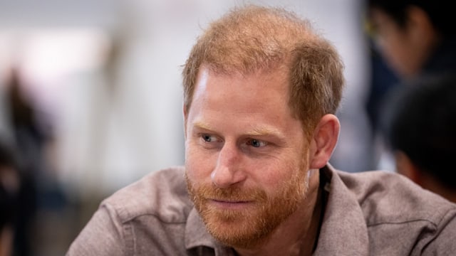 Prince Harry in a grey shirt