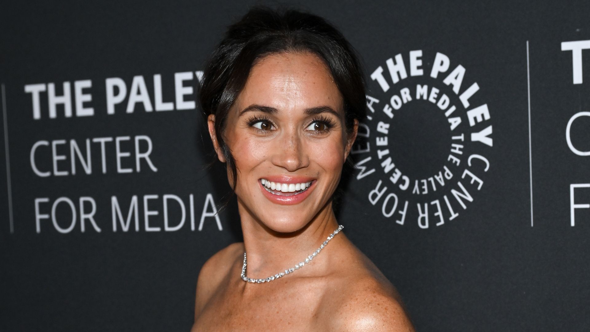 Meghan Markle stuns in pink as she celebrates incredible baby news