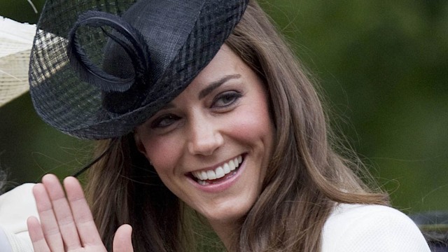 The Princess of Wales in a white coat with a black hat