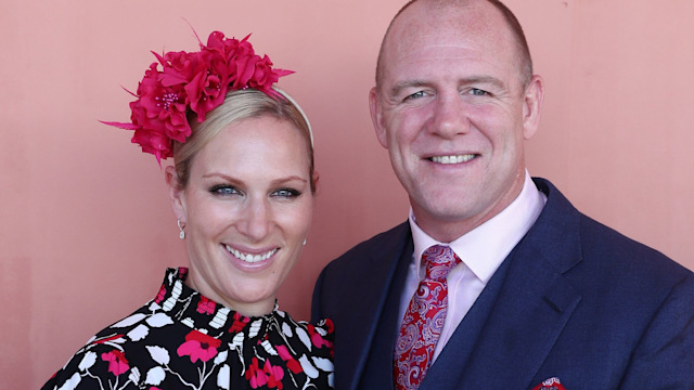 Zara Tindall in a floral dress with husband Mike Tindall against a pink backdrop