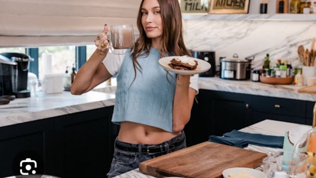 Hailey in her black and marble kitchen 