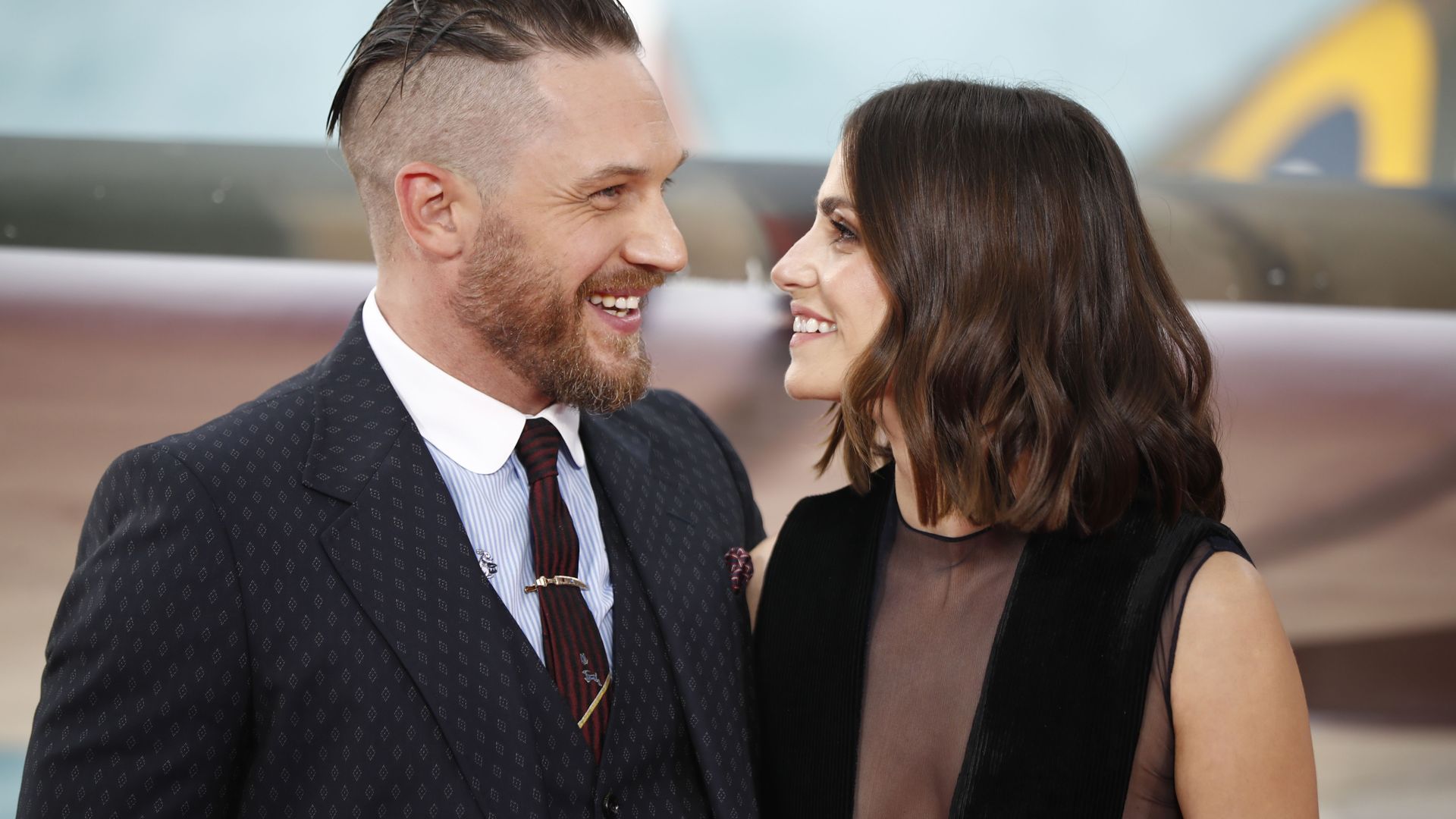 British actor Tom Hardy and his wife Charlotte Riley pose for a photograph upon arrival for the world premiere of Dunkirk