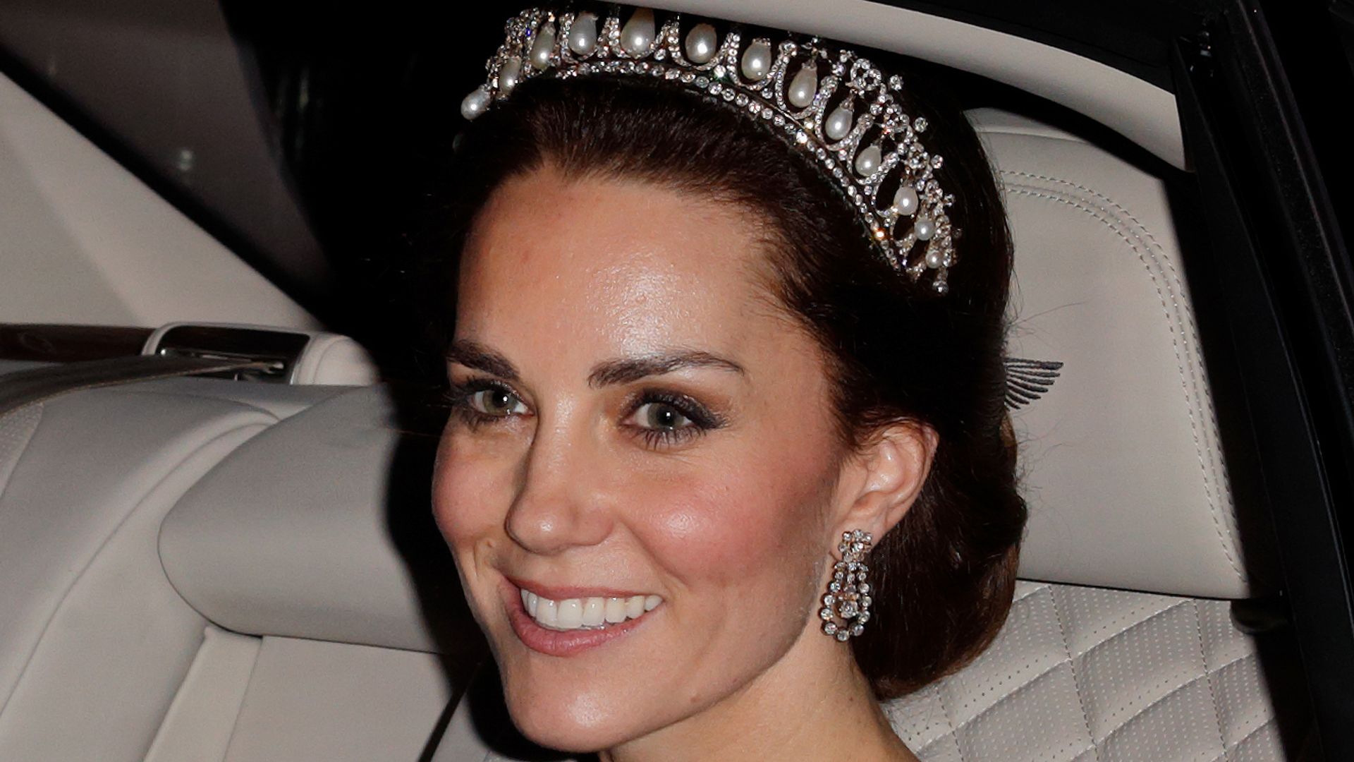 Kate Middleton, the Princess of Wales, wearing a tiara departs after attending the annual Diplomatic Reception at Buckingham Palace on December 8, 2016 in London, England. 