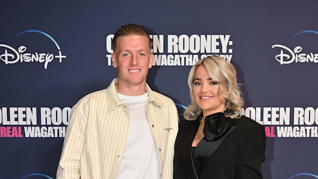 couple posing on red carpet