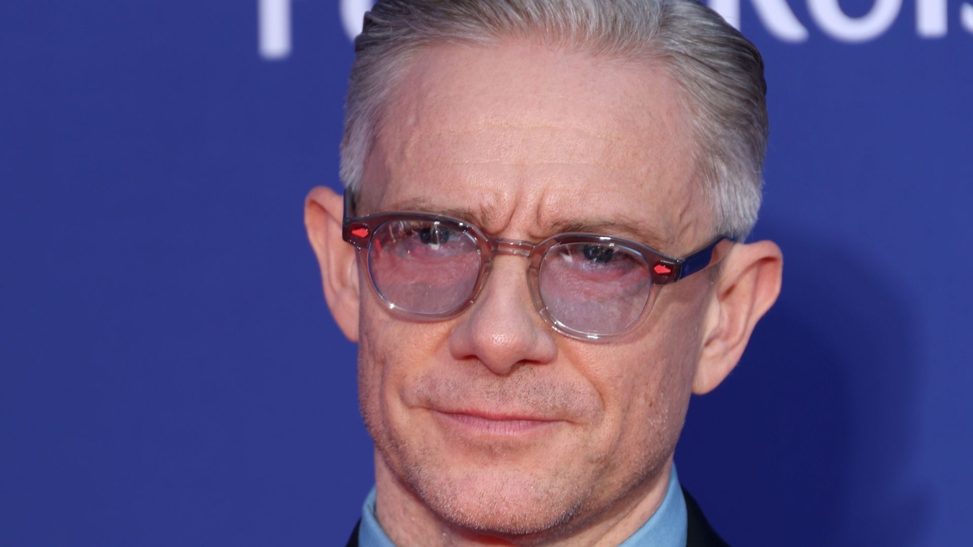 Martin Freeman wearing glasses and suits as he poses for photos at the 2025 BAFTA Television Awards with P&O Cruises