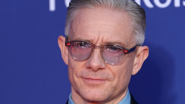 Martin Freeman wearing glasses and suits as he poses for photos at the 2025 BAFTA Television Awards with P&O Cruises