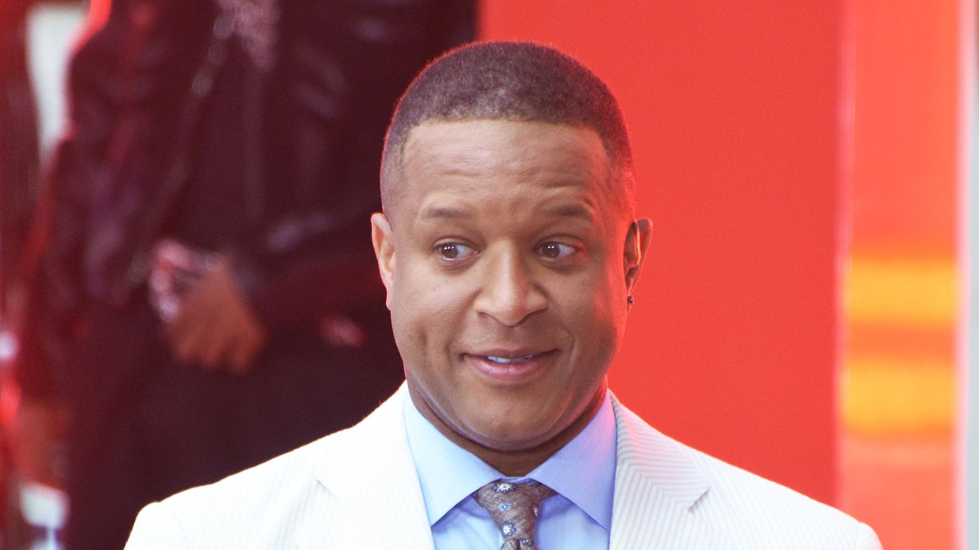 craig melvin holding microphone on stage