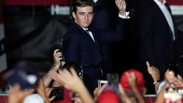 Barron Trump gestures after his father Republican presidential candidate former President Donald Trump introduced him during a campaign rally in Florida