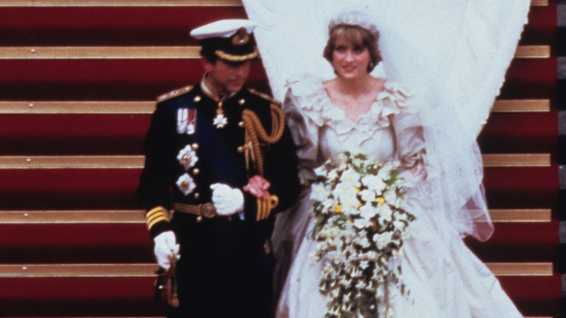 Prince Charles and Princess Diana walking down the stairs at St. Paul's Cathedral following their wedding on July 29, 1981 