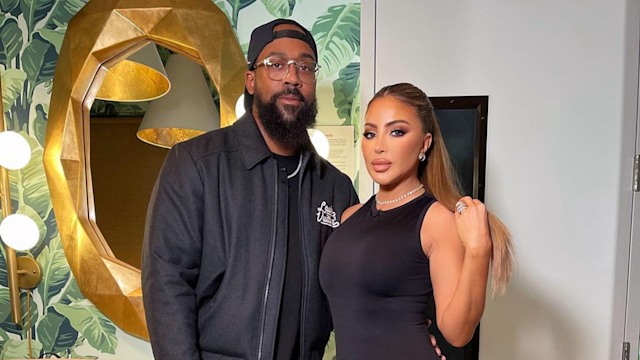 Instagram photo of Larsa Pippen in black dress posing with boyfriend Marcus Jordan