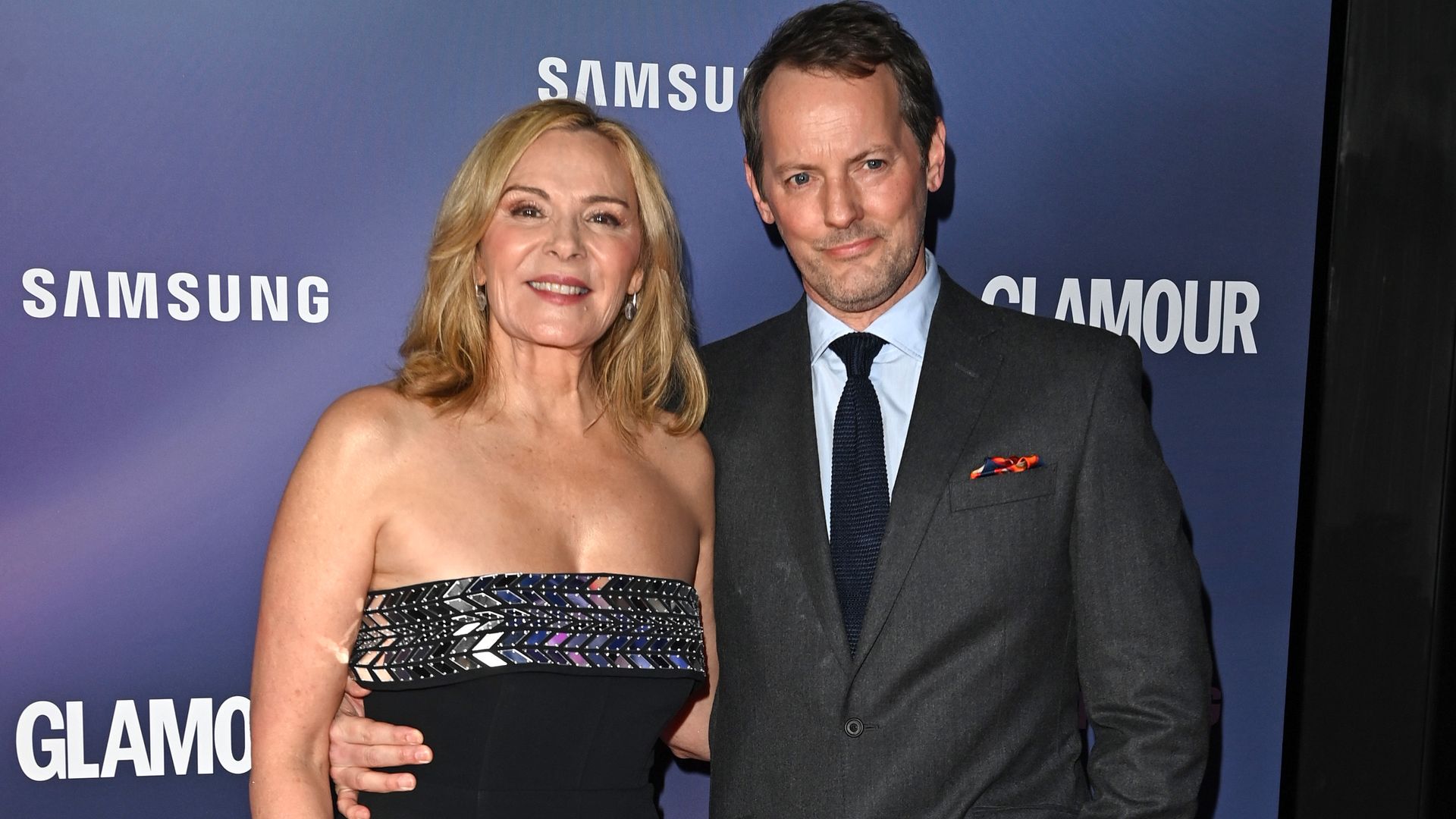 Kim Cattrall and Russell Thomas on a red carpet in 2022