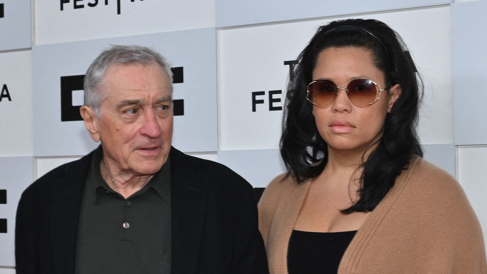 Robert De Niro and his girlfriend Tiffany Chen arrive to the screening of "Kiss the Future" during the opening night of the Tribeca Film Festival at OKX Theater in New York City on June 7, 2023