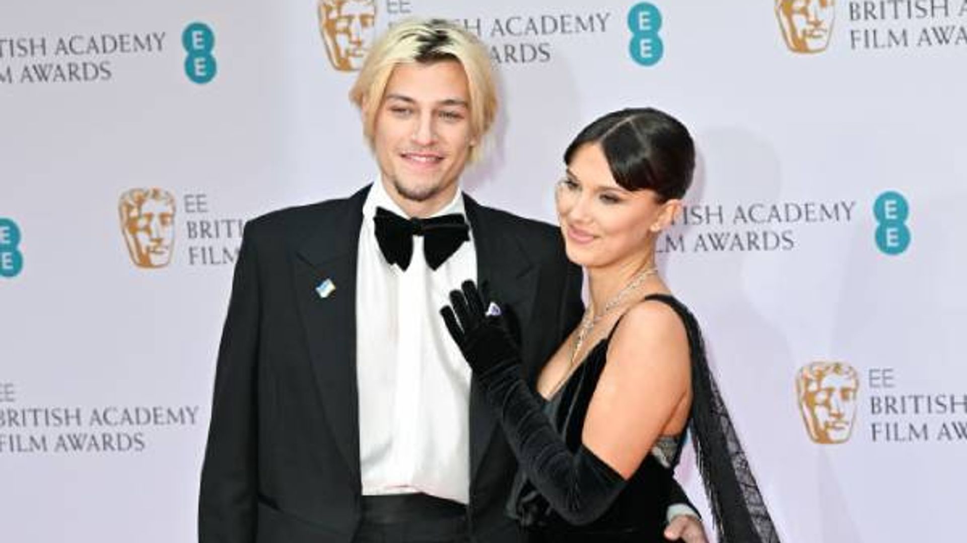 Millie Bobby Brown  and Jake Bongiovi pose at the British Film Awards