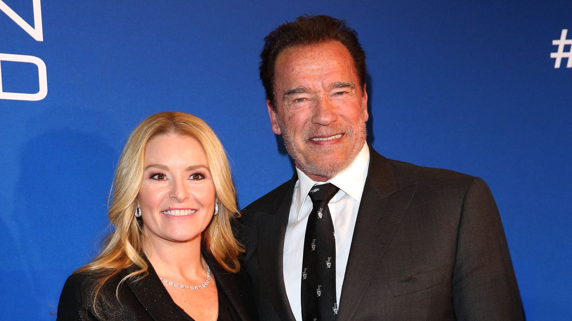 Arnold Schwarzenegger and his girlfriend Heather Milligan during the Schwarzenegger climate initiative charity dinner on January 23, 2020 in Kitzbuehel, Austria