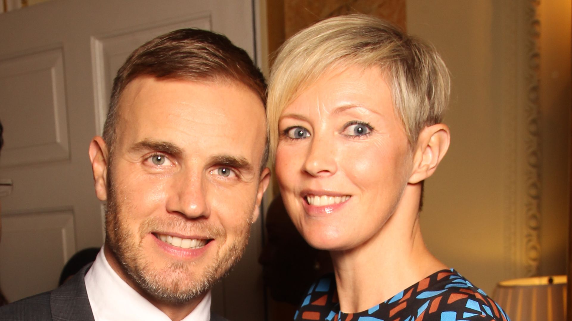 Gary Barlow with his wife Dawn smiling 