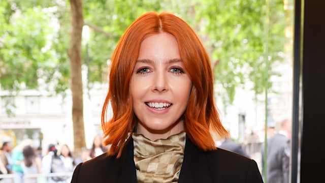 Stacey Dooley in black trenchcoat