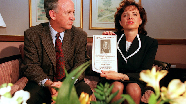 John and Patsy Ramsey, the parents of JonBenet Ramsey, meet with a small selected group of the local Colorado media after four months of silence  in Boulder, Colorado on May 1, 1997. Patsy holds up a reward sign for information leading to the arrest of their daughter's murderer.  Their 6-year-old daughter was found dead on Christmas night 1996