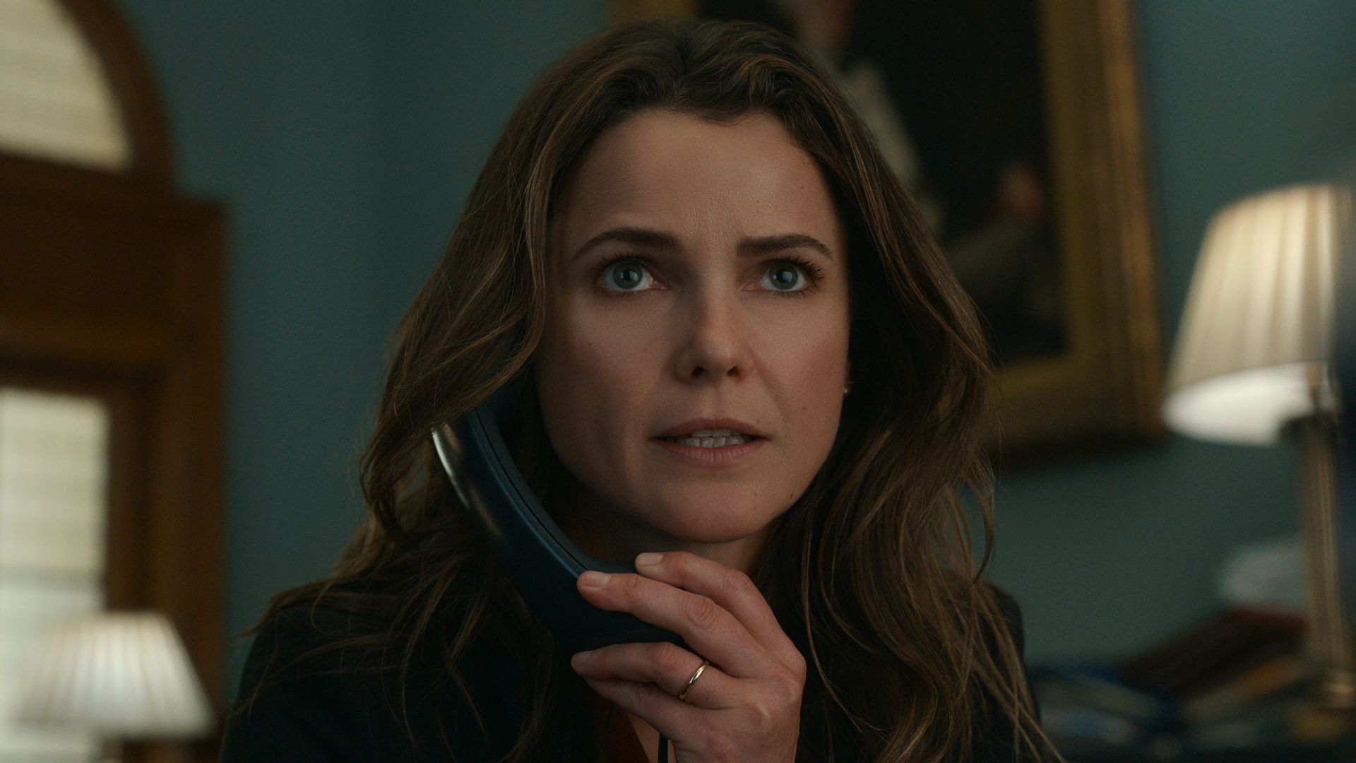 Keri Russell as Kate Wyler takes phone call in The Diplomat on Netflix
