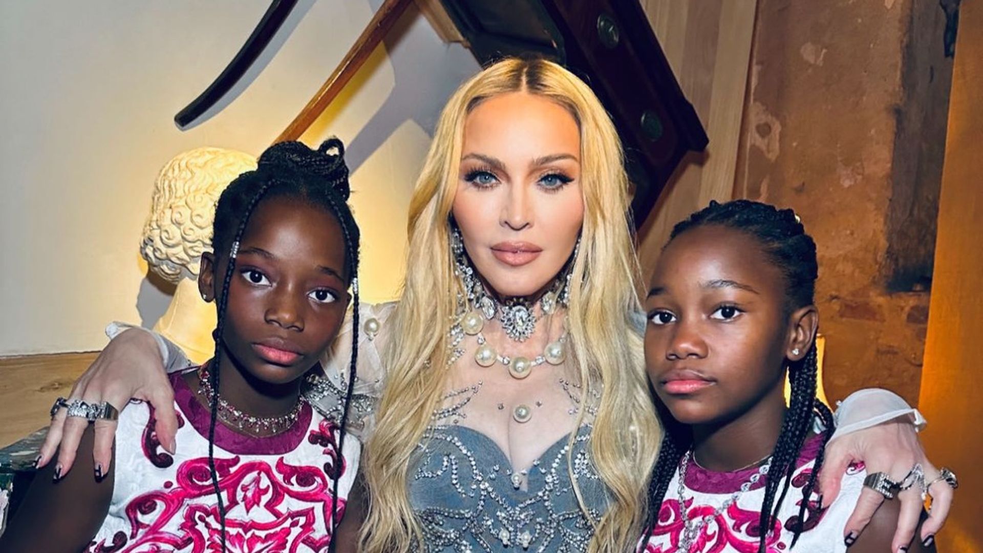 Madonnas twin daughters Stella and Estere look so tall in rare new photo from family trip