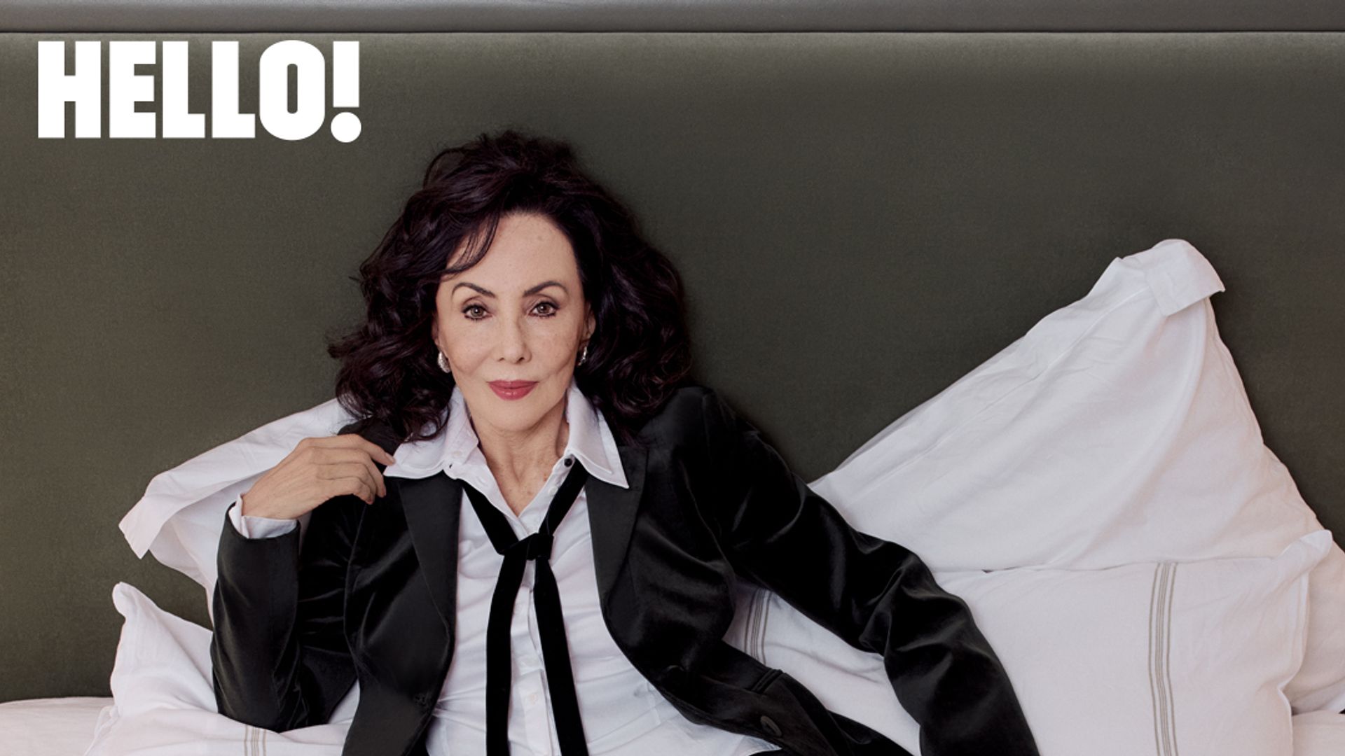 Marie Helvin posing for exclusive HELLO shoot in a suit